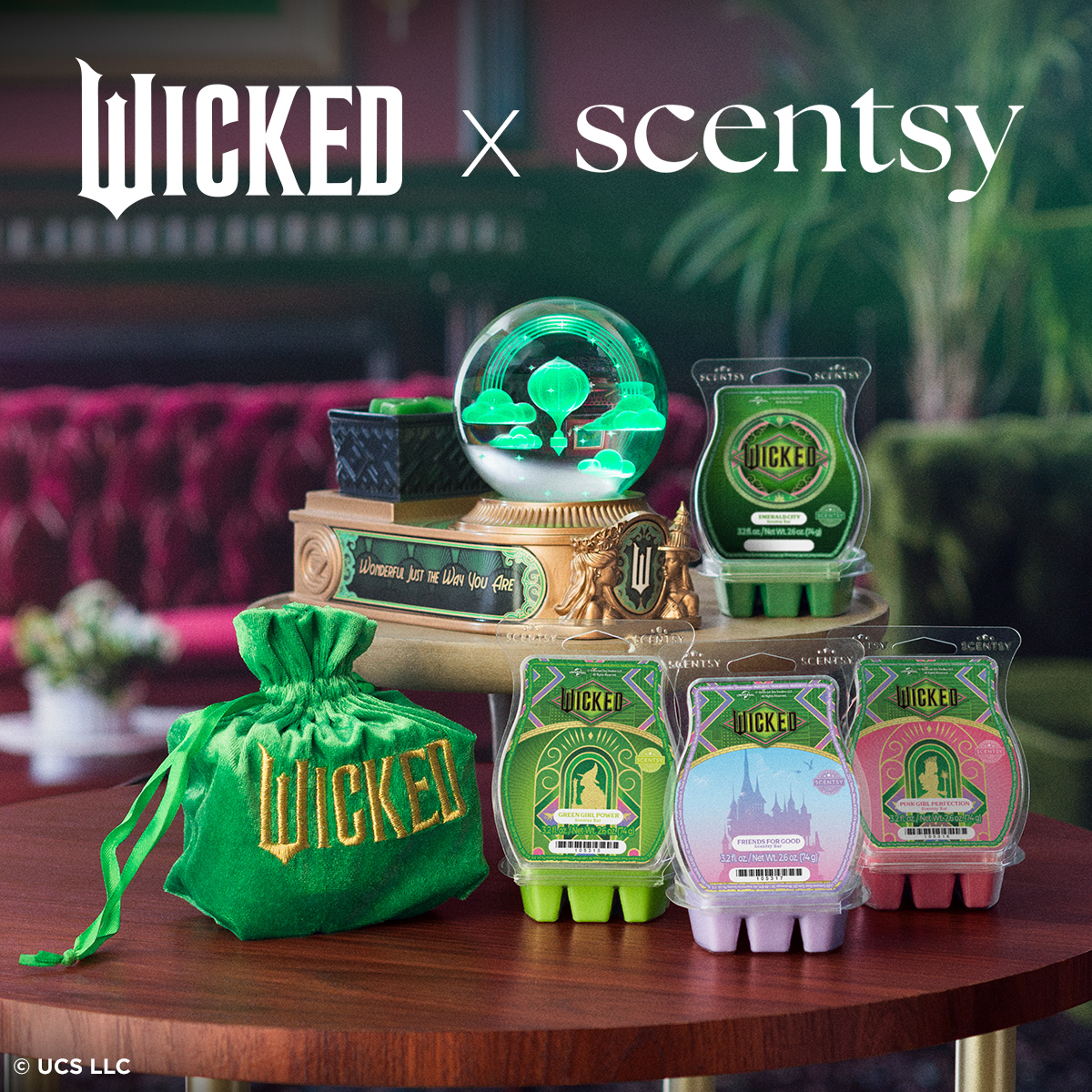 The Wicked x Scentsy Collection featuring the Emerald City Warmer and a lineup of scented wax bars inspired by the Broadway hit. Includes a green velvet Wicked pouch, themed bars, and magical decor — perfect for fans and fragrance lovers.