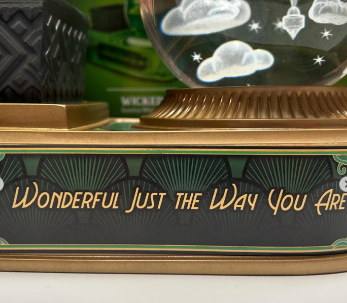Quote detail ‘Wonderful Just the Way You Are’ on the base of the Wicked x Scentsy Emerald City Warmer — a nod to the heart and friendship at the center of the Wicked story.