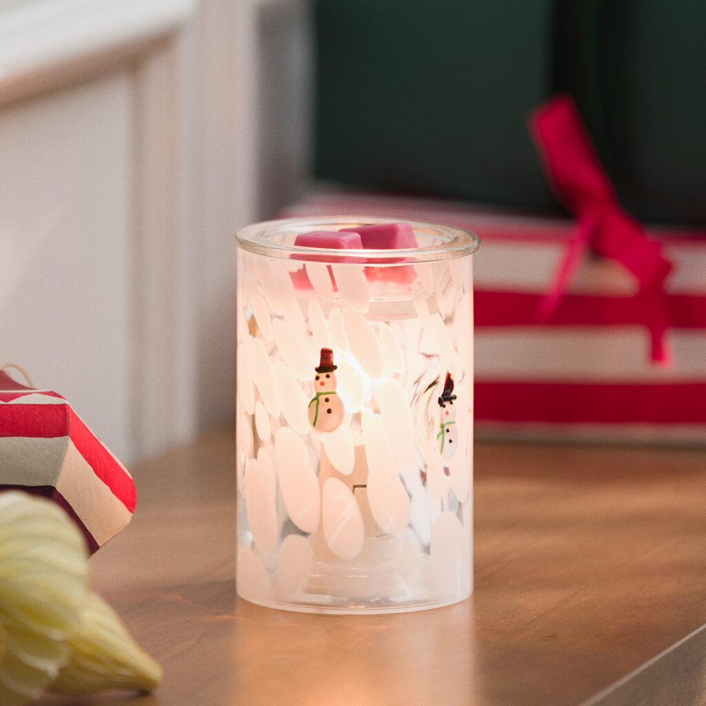Scentsy Snowman Confetti Glass Warmer featuring frosted glass dotted with snowflake-style confetti and tiny snowman designs. Warm, whimsical, and perfect for a playful Christmas vibe.