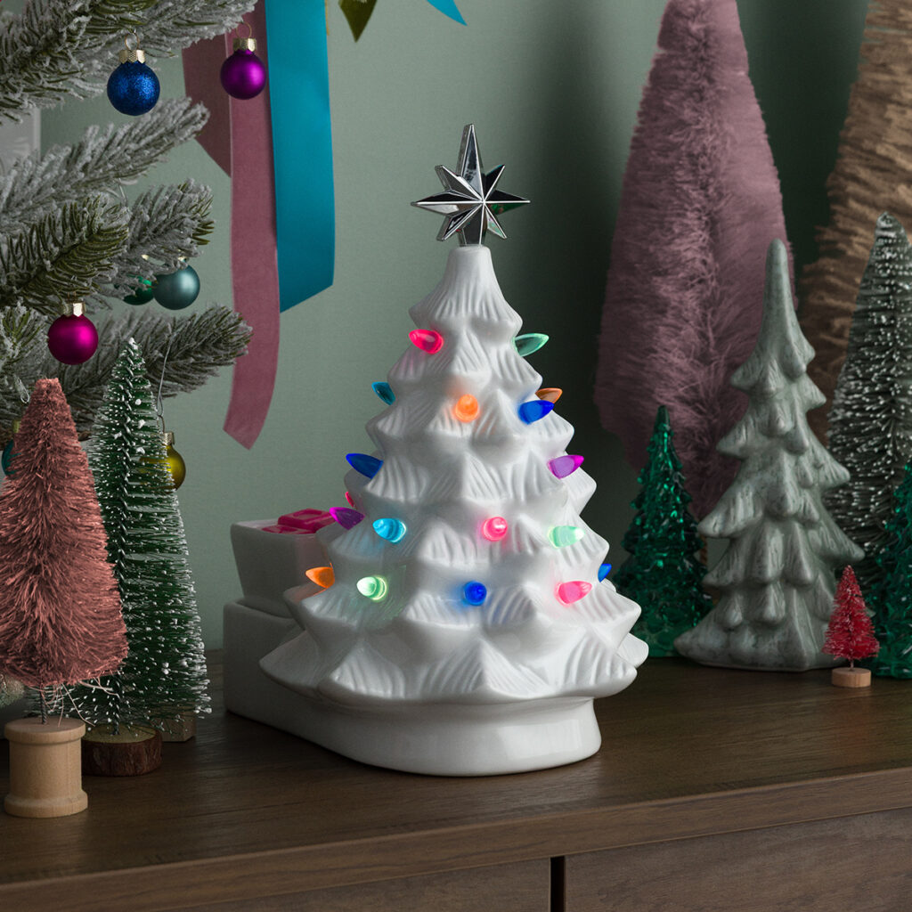 “The Merry Little Christmas Tree in White by Scentsy glowing with colorful retro bulbs — the ultimate nostalgic Christmas warmer. Adds cozy vintage charm to your holiday home decor.”