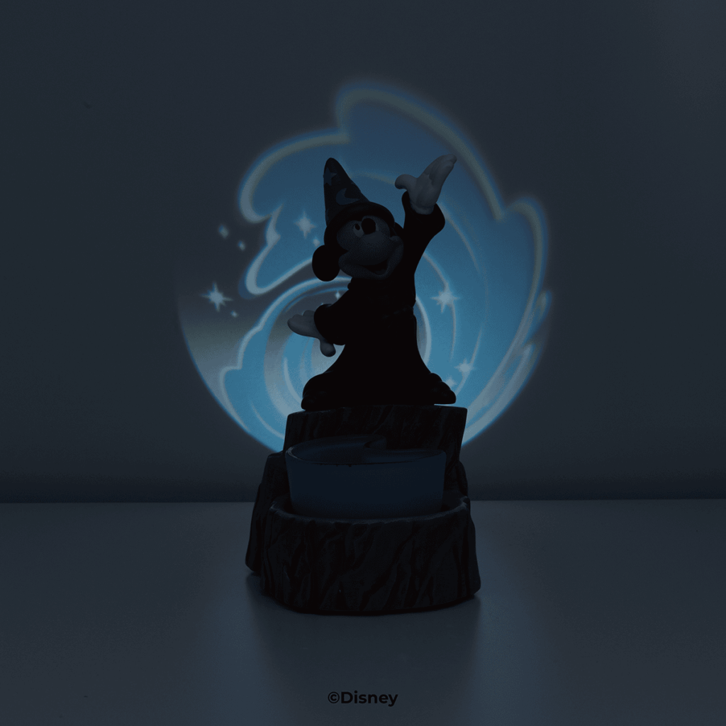 Disney Fantasia Sorcerer’s Apprentice Scentsy Warmer glowing in the dark, projecting a magical blue swirl inspired by Mickey’s spell scene.