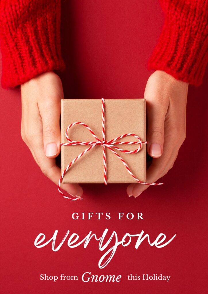 Shop from Gnome holiday graphic with hands holding a wrapped gift tied in red and white twine on a red background, promoting holiday shopping.