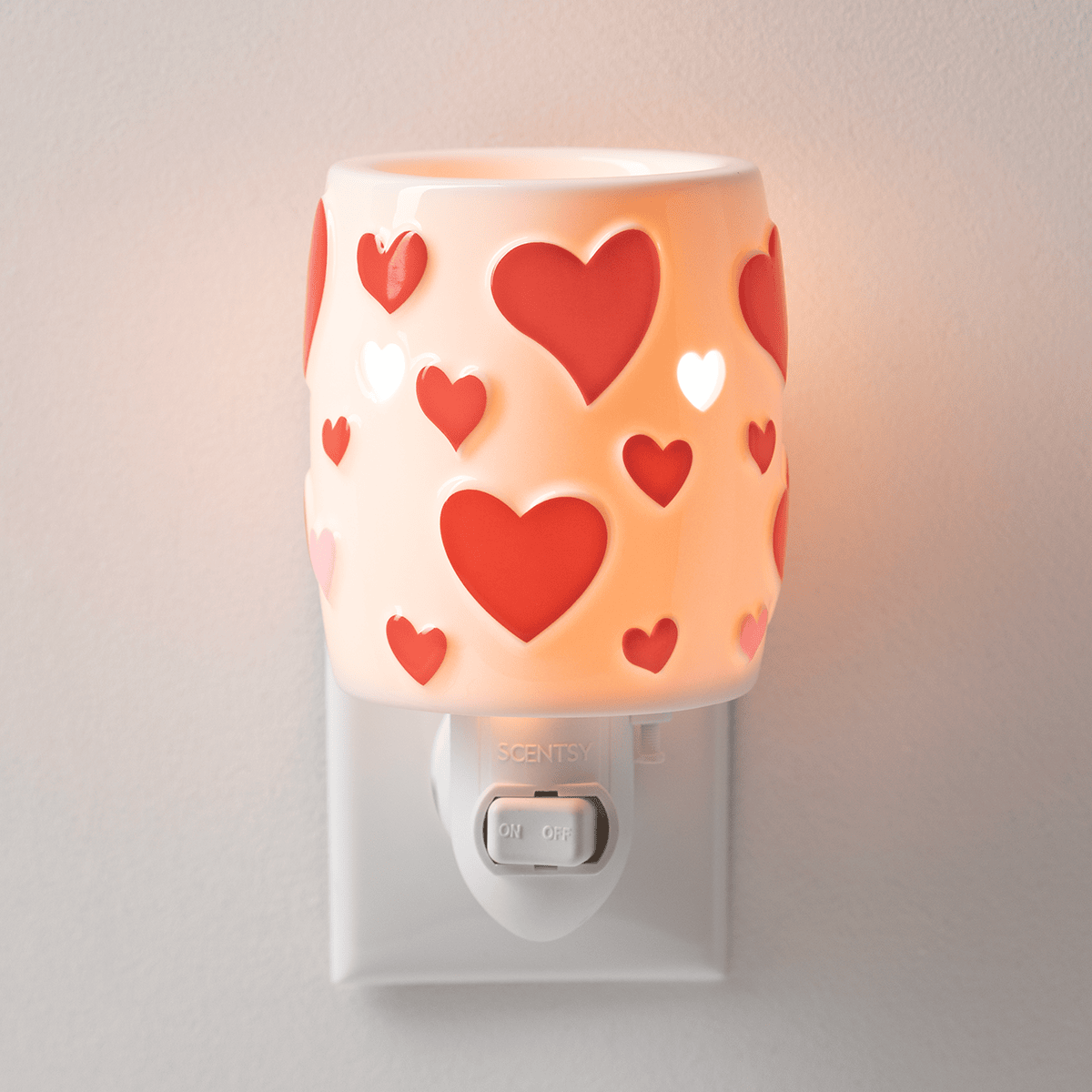 Scentsy Heartstruck Mini Warmer with glowing heart cutouts, perfect for Valentine’s Day and small spaces.