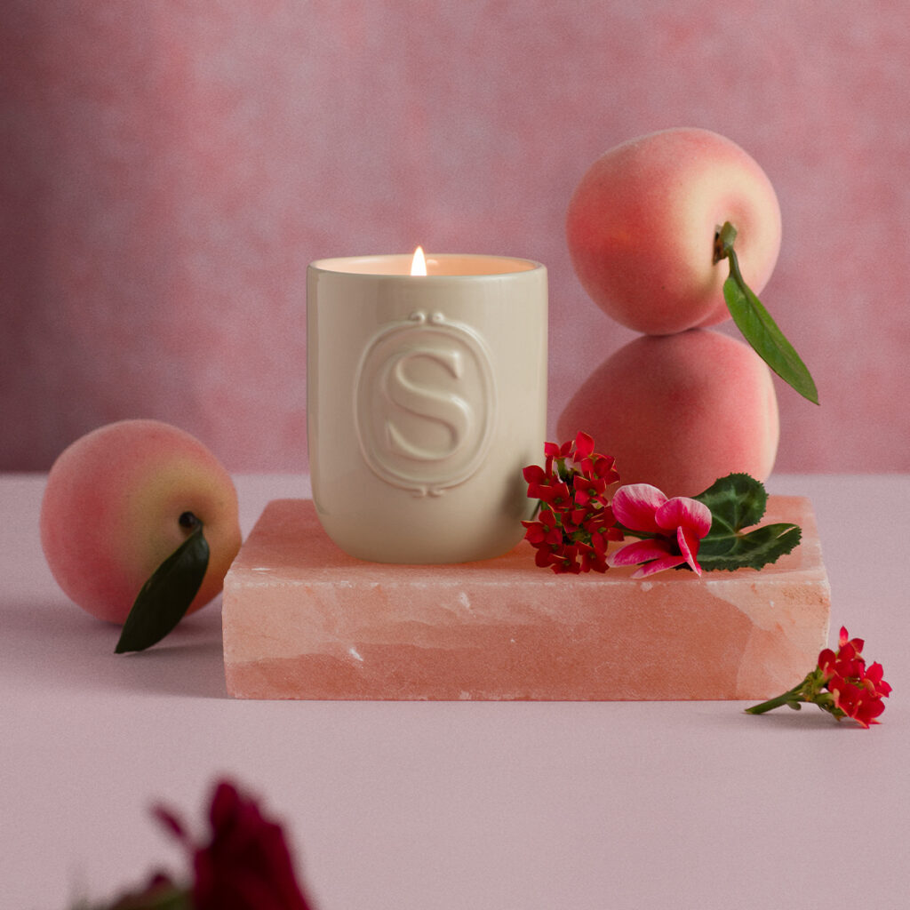 Scentsy Poems & Petals scented candle styled with soft florals and Valentine’s-inspired colors.