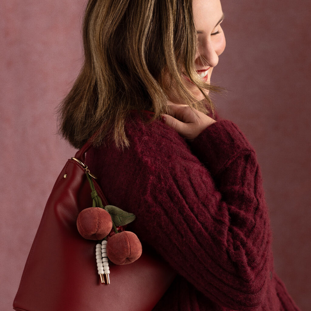 Santina Cherry Scentsy buddy clip styled on a handbag for Valentine’s Day gifting.