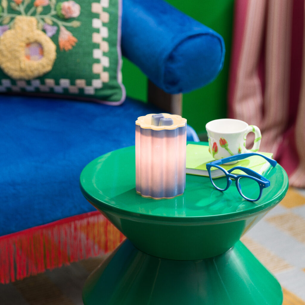 Bloomie Blue Scentsy warmer lit and glowing, part of the Bloomie Collection