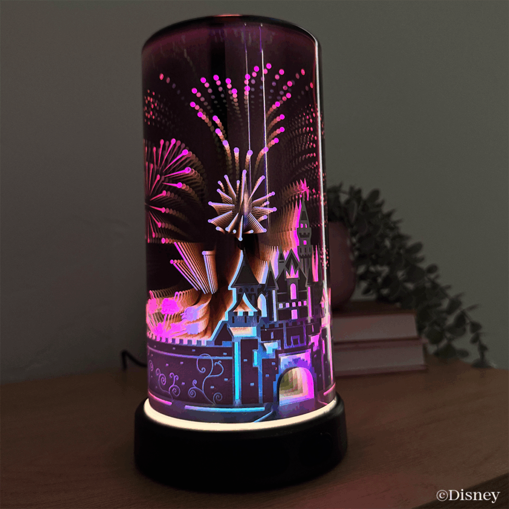 Sleeping Beauty Castle Scentsy diffuser lit with colorful fireworks detail from the Disneyland 70th Anniversary collection.