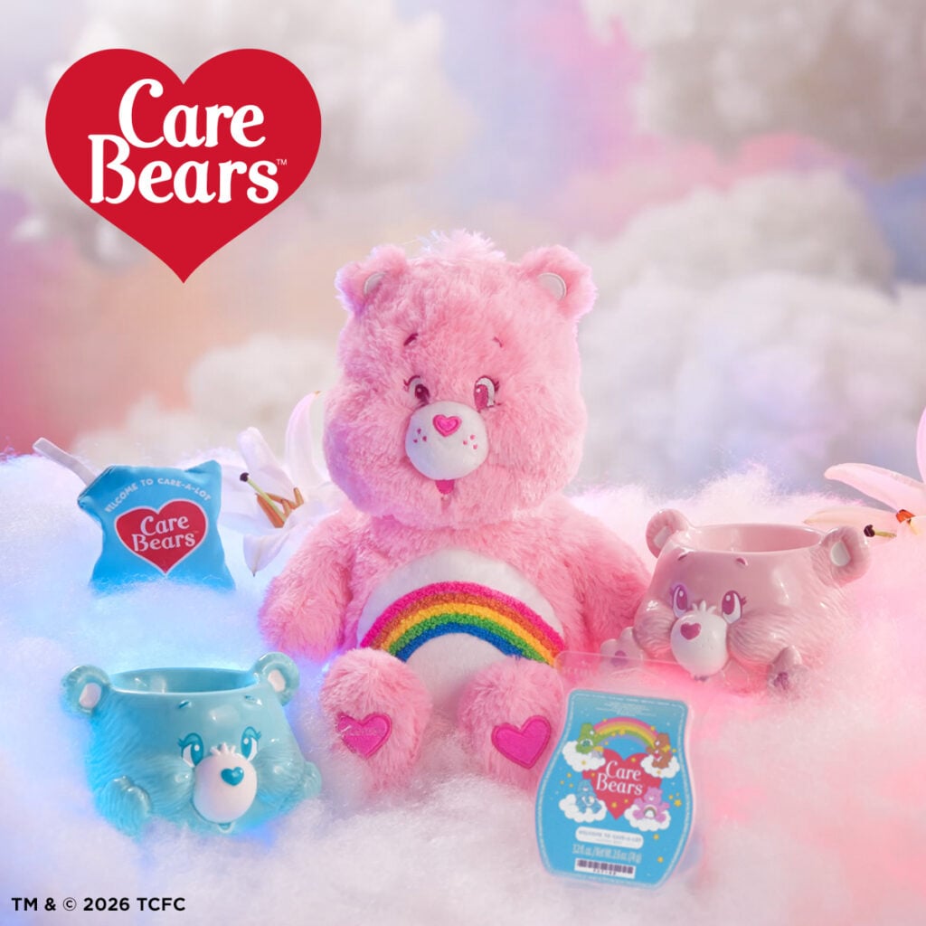 Care Bears Scentsy collection featuring Cheer Bear buddy, Bedtime Bear warmer, Cheer Bear warmer, and Care Bears wax bar on a colorful cloud background.