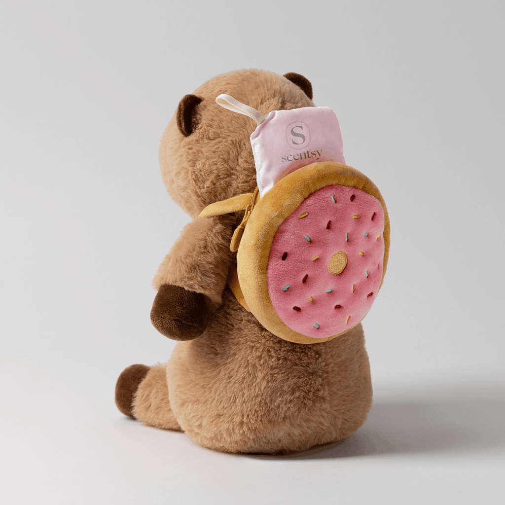 Crumb the Capybara Scentsy Buddy with his donut backpack that holds a scent pak