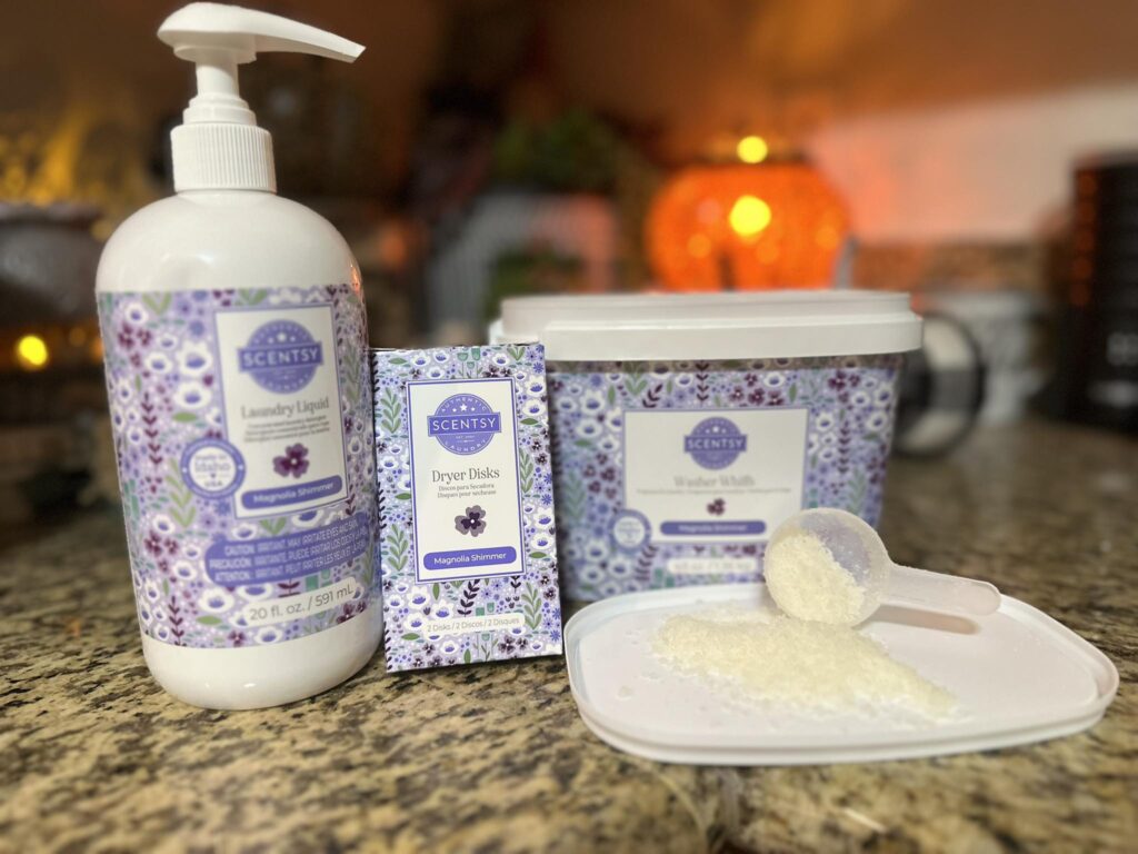Scentsy Fluffy Fleece Washer Whiffs with measuring scoop for adding long-lasting fragrance to laundry.