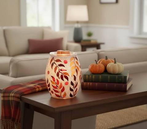 Scentsy Warmer, Canopy of Colors warmer featuring colorful autumn leaves glowing on a living room table with fall décor.