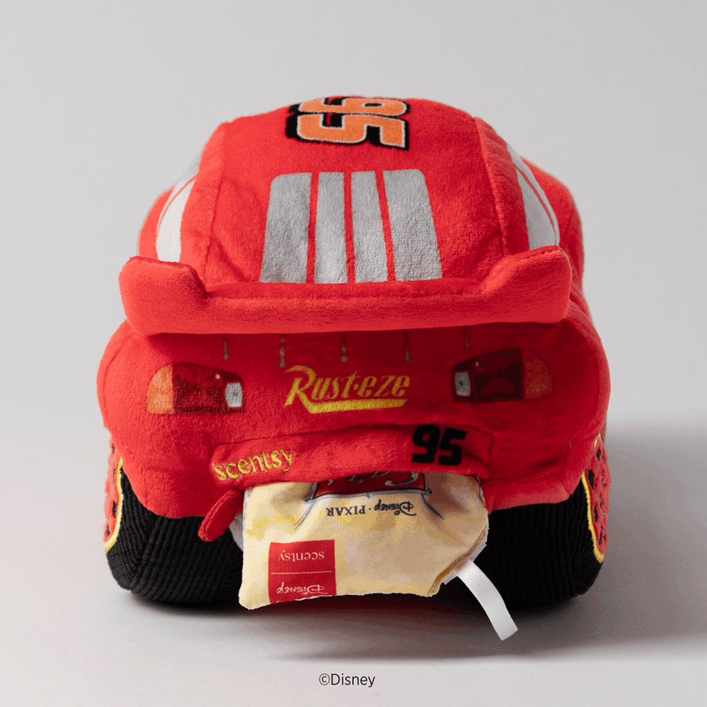 Back view of the Disney Pixar Cars Lightning McQueen Scentsy Buddy with the Radiator Springs Scent Pak inserted into the plush.