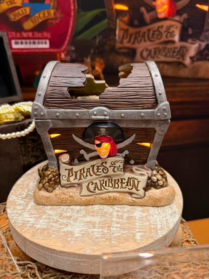 Disney Pirates of the Caribbean Scentsy warmer designed as a weathered pirate treasure chest with a glowing pirate skull on the front.