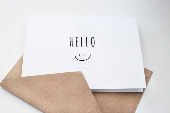 Greeting card with the word "Hello" and a smiley face linking to Amber Grillot's Send a Smile request page.