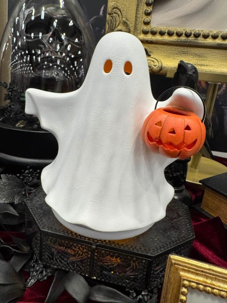 Boo's Treat Scentsy Warmer featuring a white ghost holding a glowing jack-o'-lantern bucket from the Scentsy September Halloween Collection.