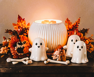 White fluted warmer with ghosts, bones, pumpkins, fall florals