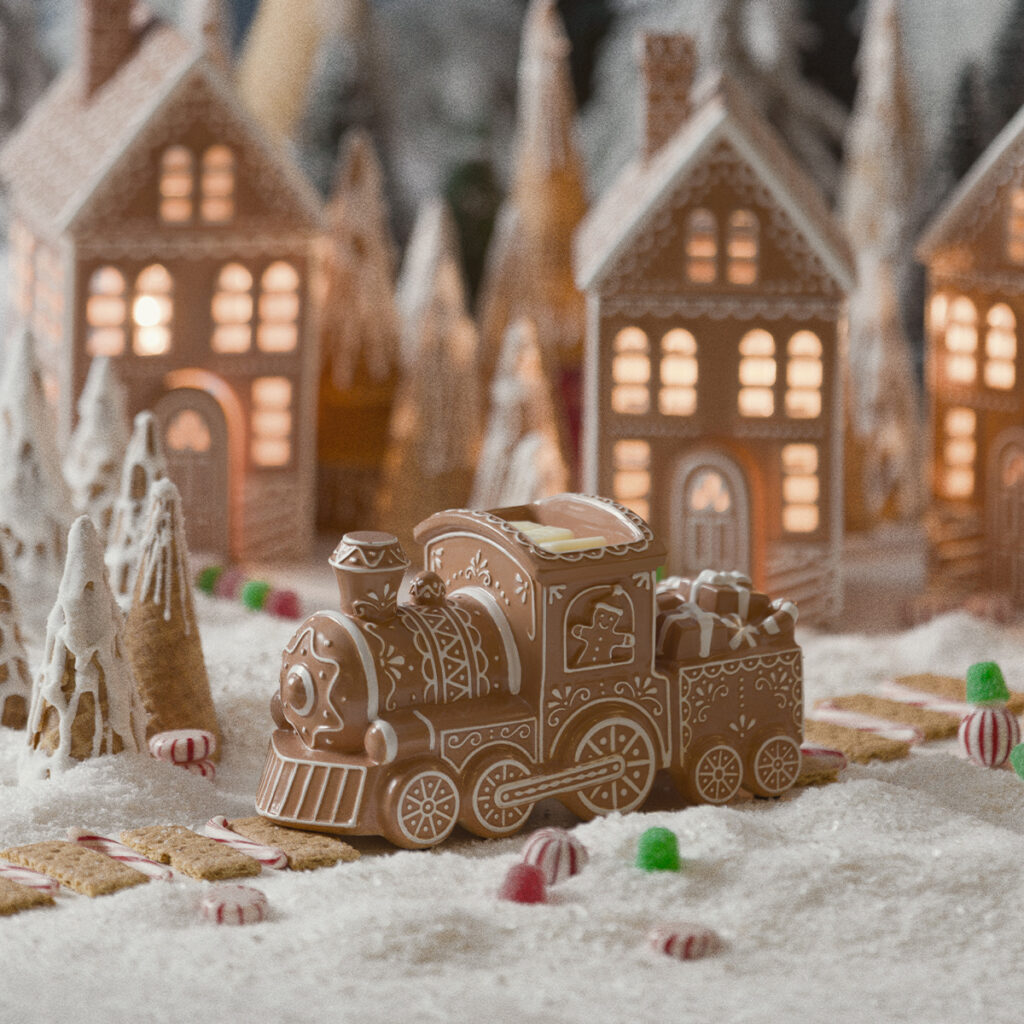 Ginger Line Scentsy Warmer shaped like a gingerbread Christmas train in a snowy gingerbread village.