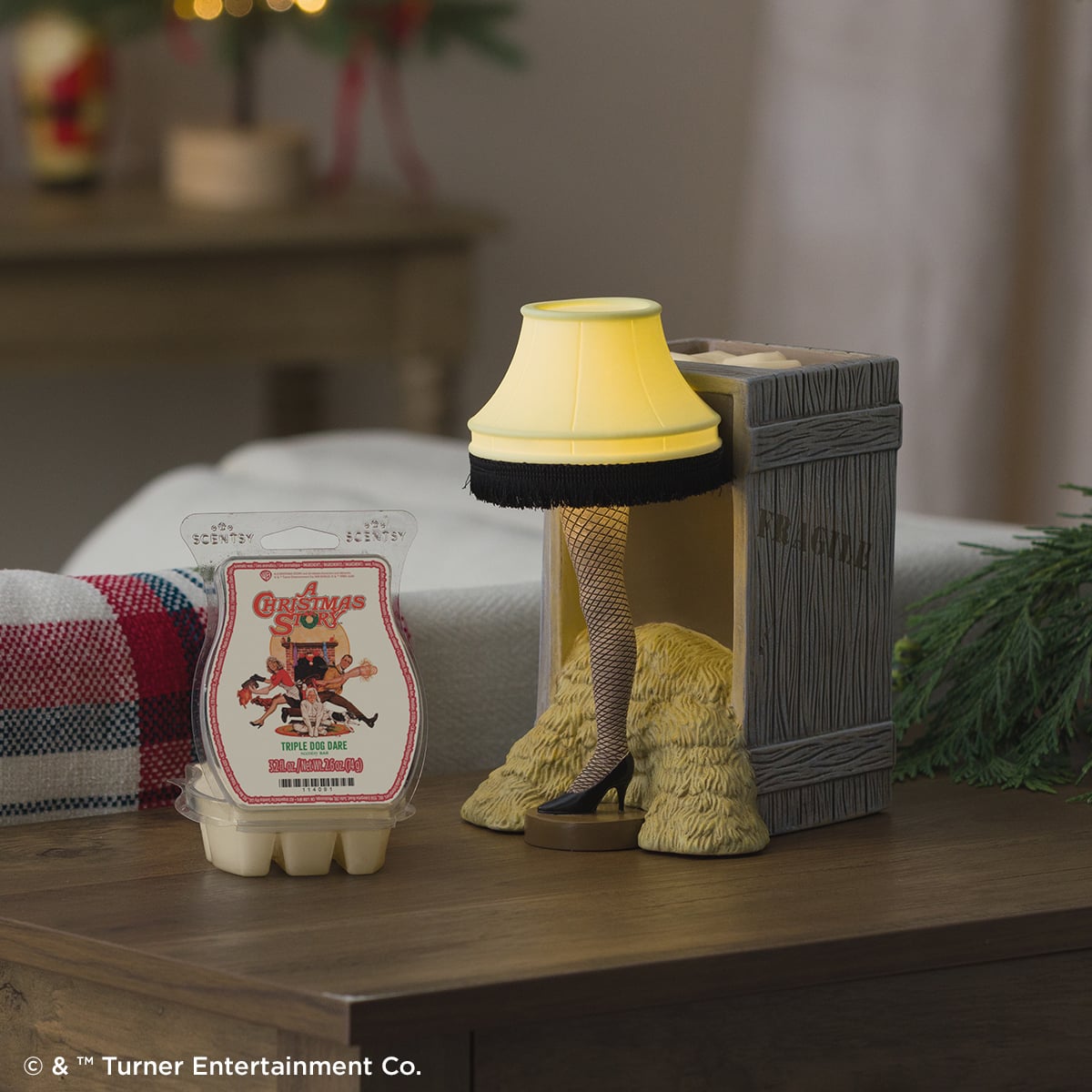 A Christmas Story Scentsy Collection featuring the iconic leg lamp warmer and Fragile box design