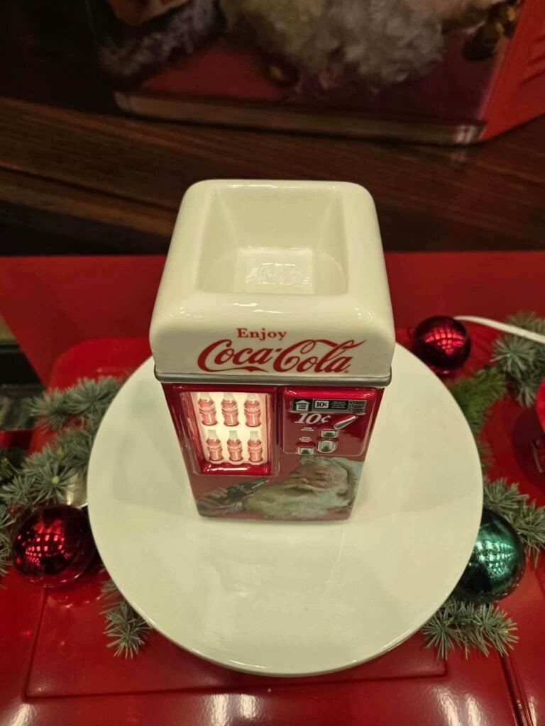Top view of the Coca-Cola Jolly Refreshment Scentsy Warmer showing the white wax dish above the vintage vending machine design.