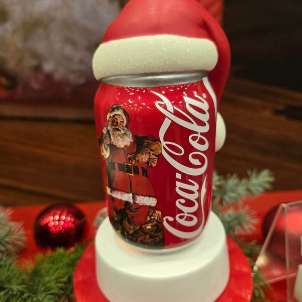 Coca-Cola Sparkling Holidays Scentsy Mini Warmer designed like a red Coca-Cola can topped with Santa's hat.