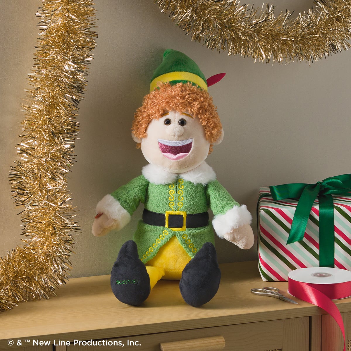 Buddy the Elf Scentsy Buddy dressed in his green Elf costume with yellow tights and black shoes.