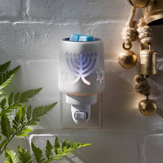 Scentsy Festival of Blessings Mini Warmer glowing with menorah and Star of David designs.