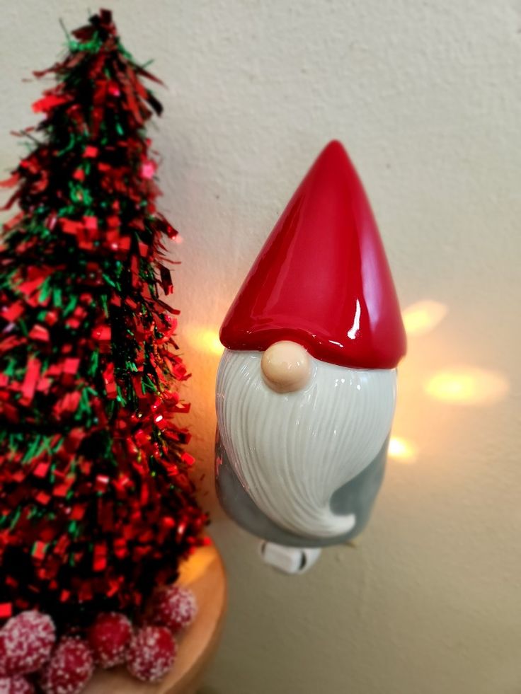 Scentsy Gnome for the Holiday Mini Warmer featuring a red pointed hat and white beard beside Christmas decor.