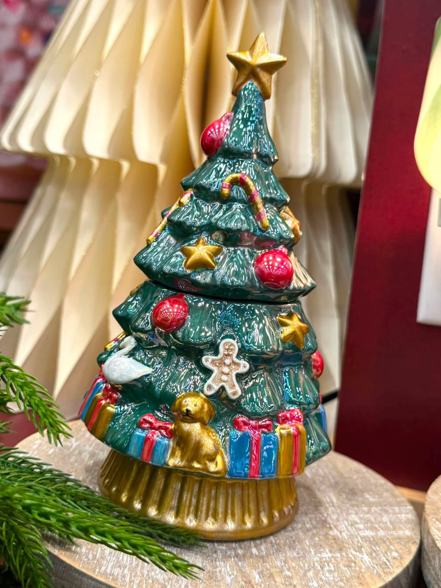 Scentsy Merry Evergreen Warmer shaped like a decorated Christmas tree with ornaments, presents and a gold star.