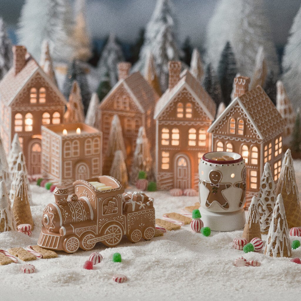 Scentsy October Edit Gingerbread Collection featuring gingerbread warmers displayed together in a snowy Christmas village.