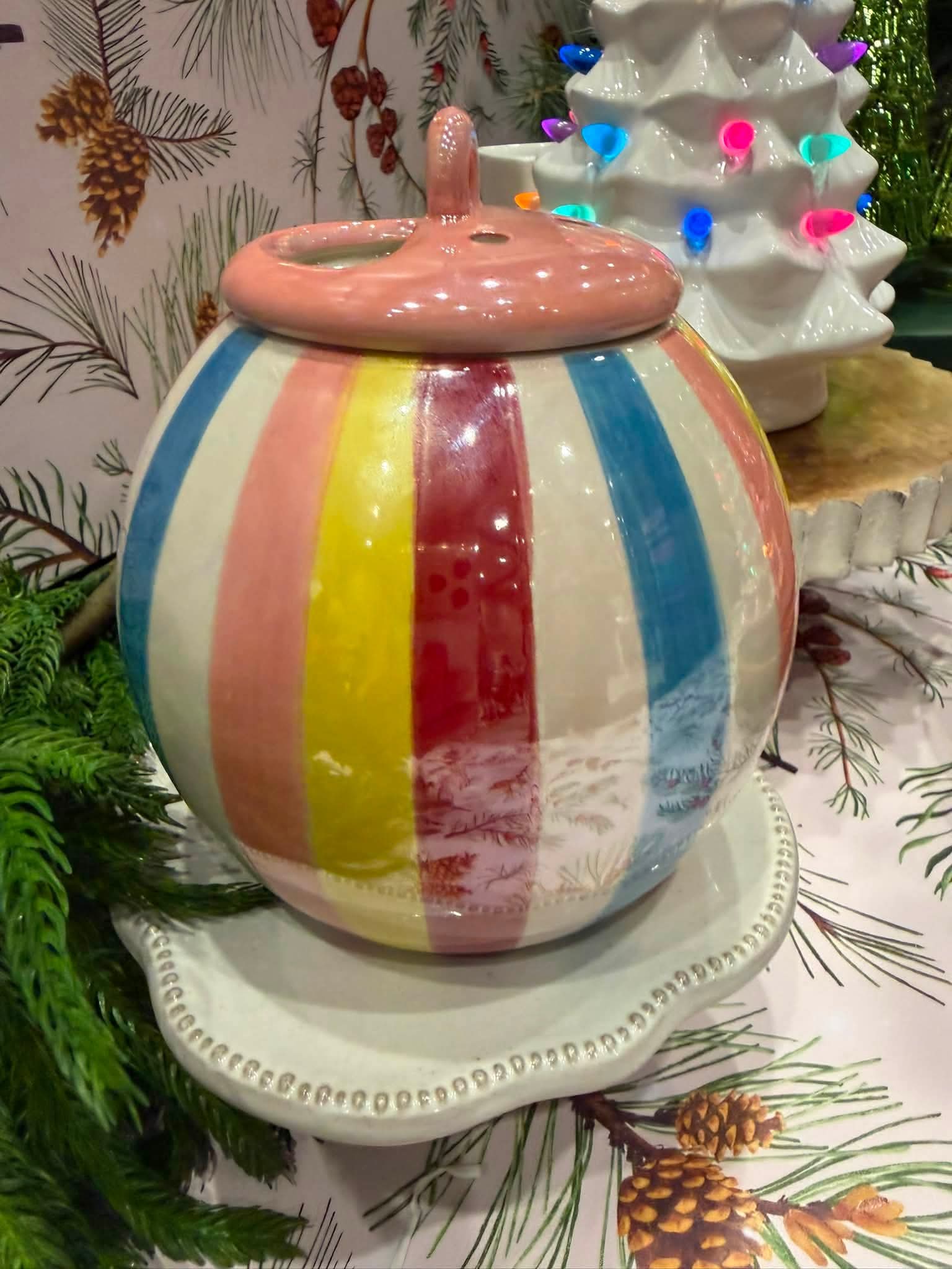 Scentsy Sugarplum Pop Warmer with colorful vertical stripes and a pink lid.