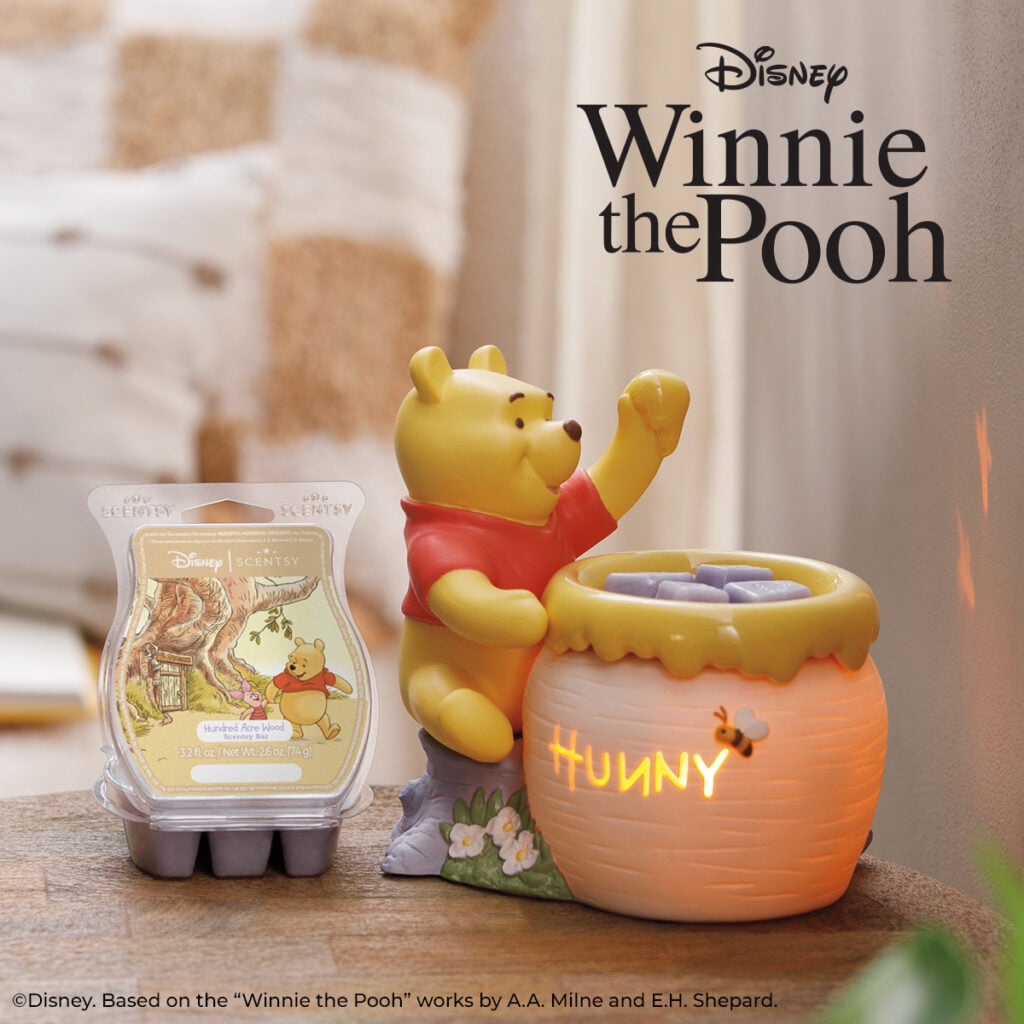 Just A Smackerel of Hunny Scentsy Warmer featuring Winnie the Pooh beside a glowing Hunny pot with Hundred Acre Wood Scentsy Bar.