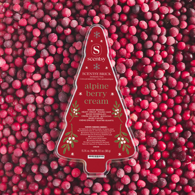 Alpine Berry Cream Scentsy Brick in red Christmas tree-shaped packaging surrounded by frosted cranberries, featuring notes of winter berries, heavy cream and pound cake.