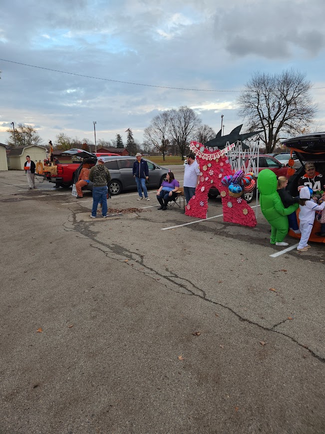 Families, decorated vehicles and Halloween displays gathered for our community Trunk or Treat event in 2023.